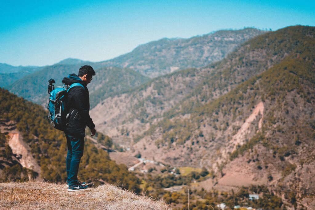 Backpacker traveler overlooking mountain scenery