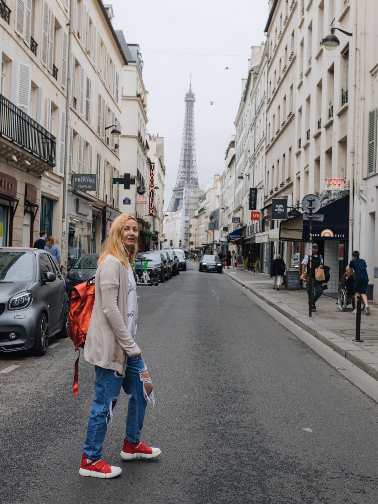 Charming Paris street with the Eiffel Tower rising in the background